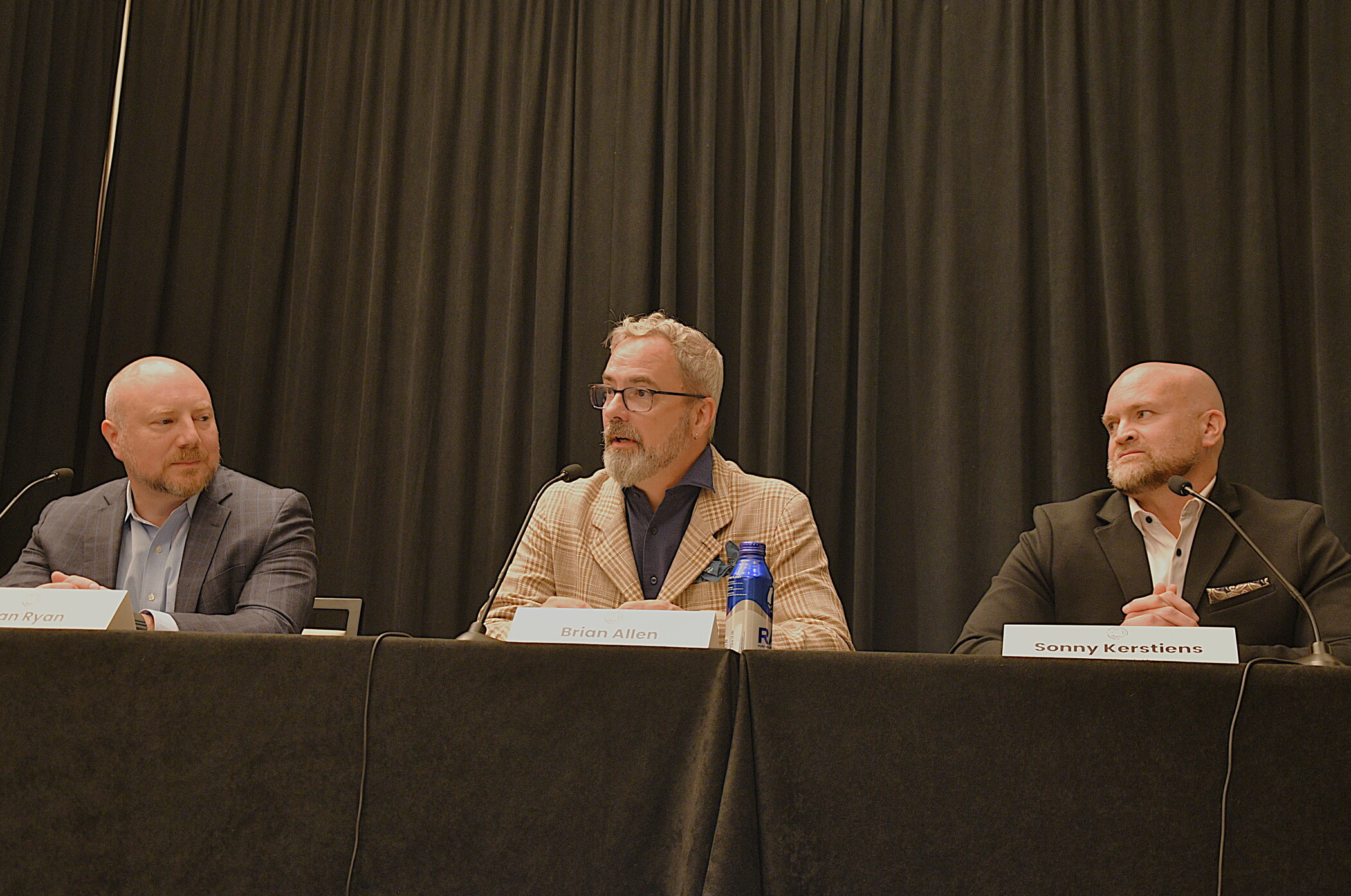 From left: Aran Ryan, of Tourism Economics; Brian Allen, of Atrium Hospitality; and Sonny Kerstiens, of Aspen Hospitality, speak on a forecast panel at the Hotel Data Conference. (Terence Baker)