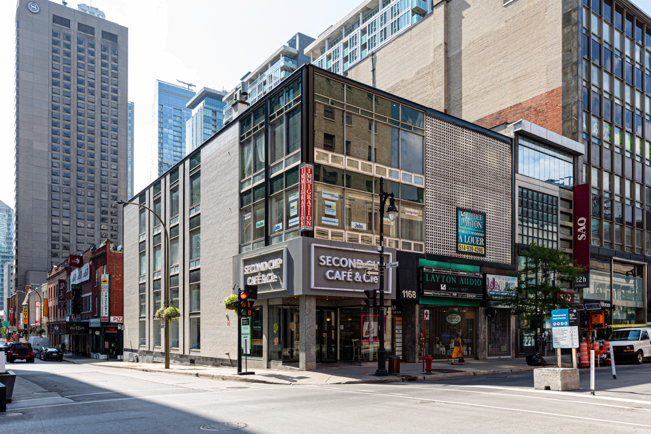 The Second Cup coffee shop on St. Catherine Street in downtown Montreal has added French wording to its signs. Such added wording will become mandatory on signs in Quebec in 2025. (CoStar)