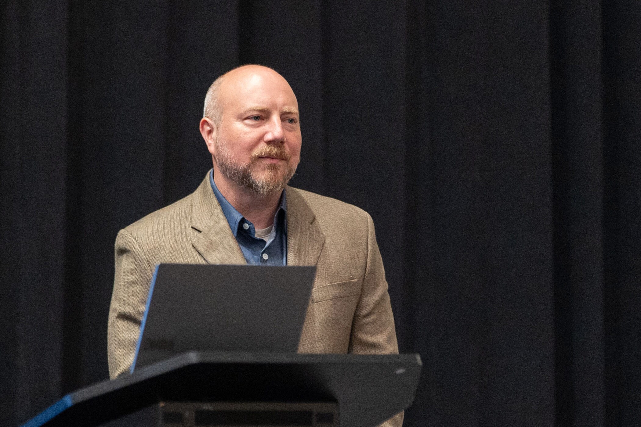 Tourism Economics' Aran Ryan speaks during the "How Geopolitical Uncertainty is Affecting Travel" session at the 2025 Hotel Data Conference in Nashville, Tennessee. (CoStar)