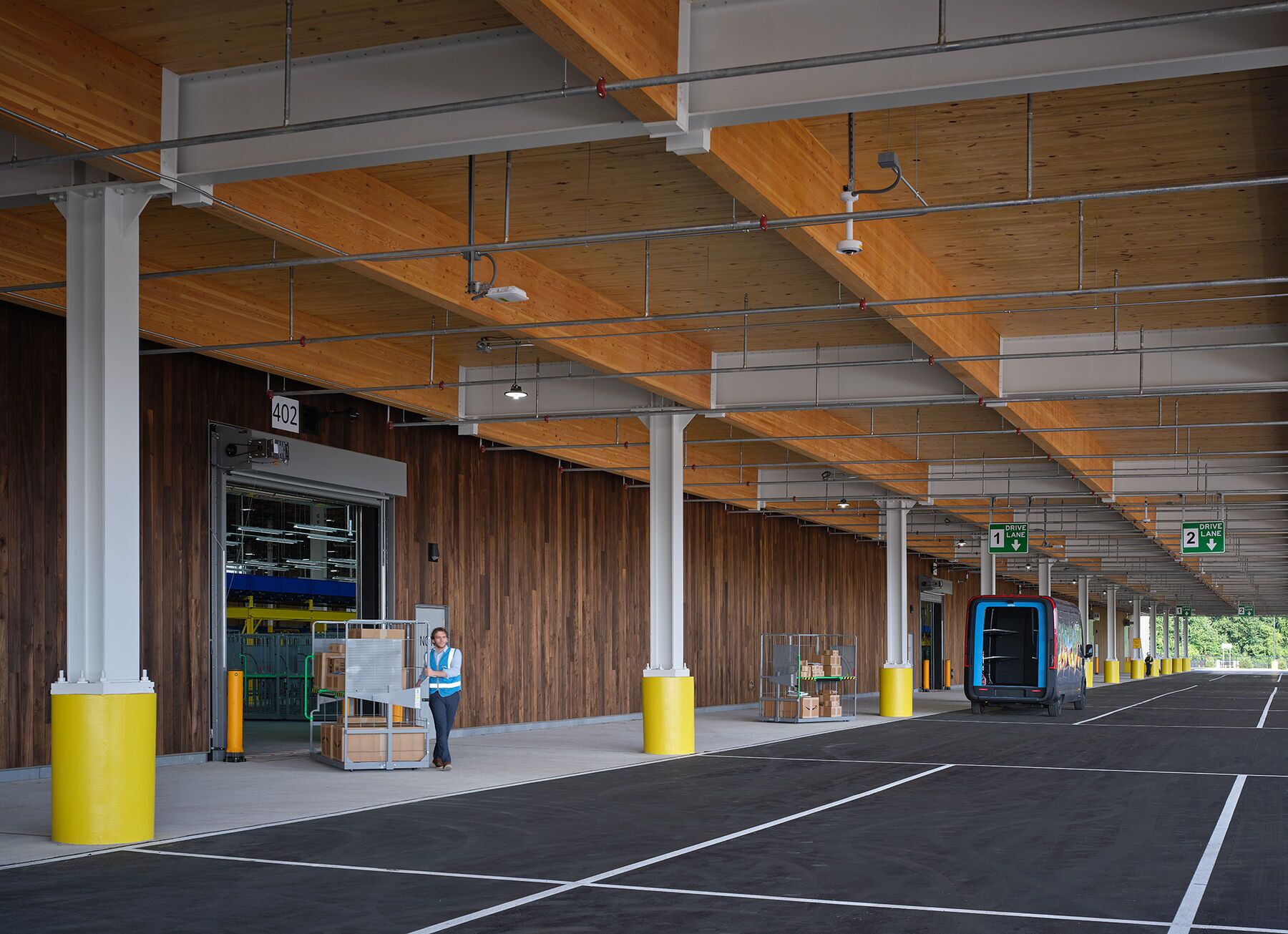 Amazon's new distribution center in Elkhart, Indiana, makes extensive use of timber as structural support, replacing steel and concrete. (ZGF Architects)
