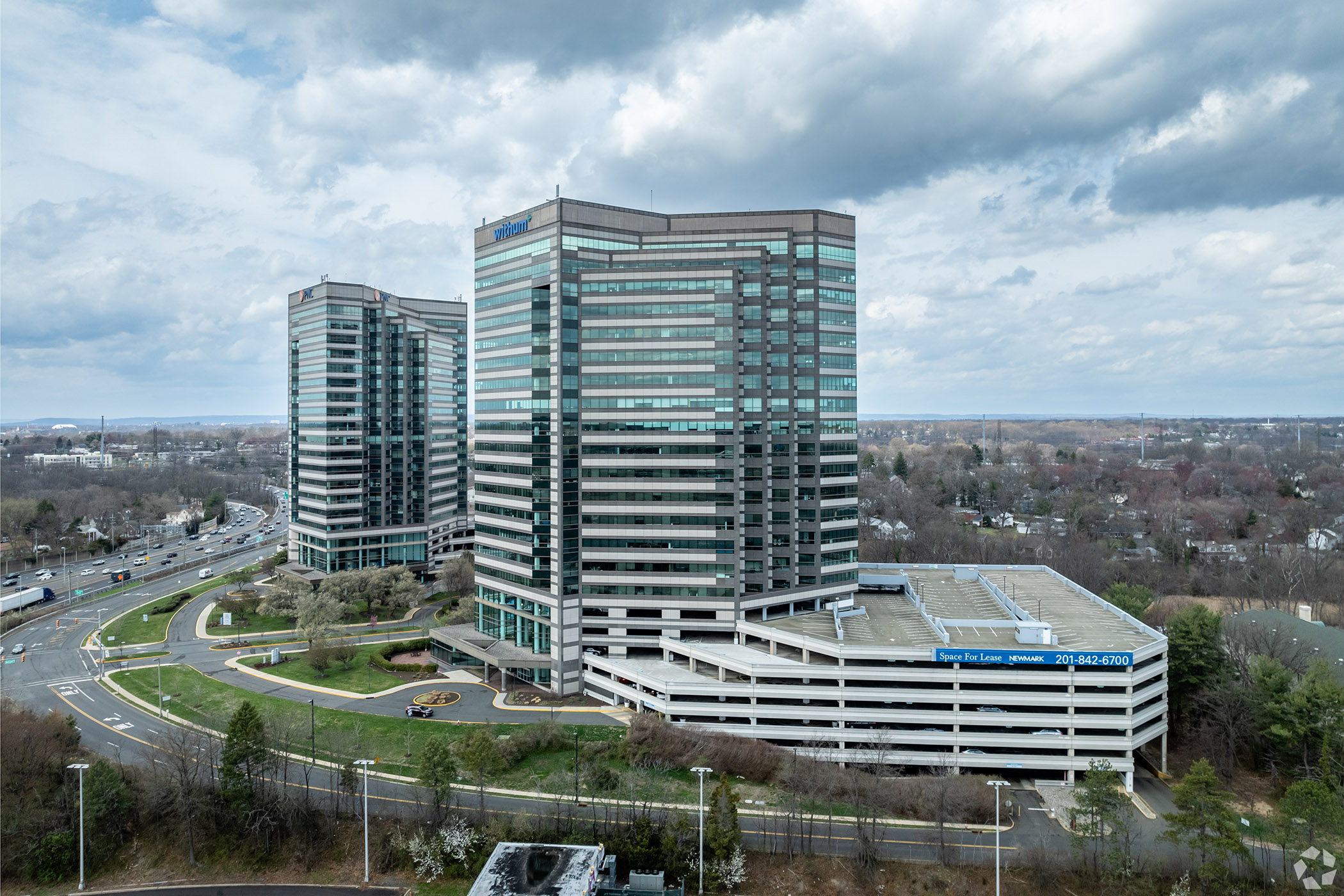 Tower Center 1 in East Brunswick, New Jersey, is one of four U.S. properties backing a new Israeli bond offering. (James Hooker/CoStar)