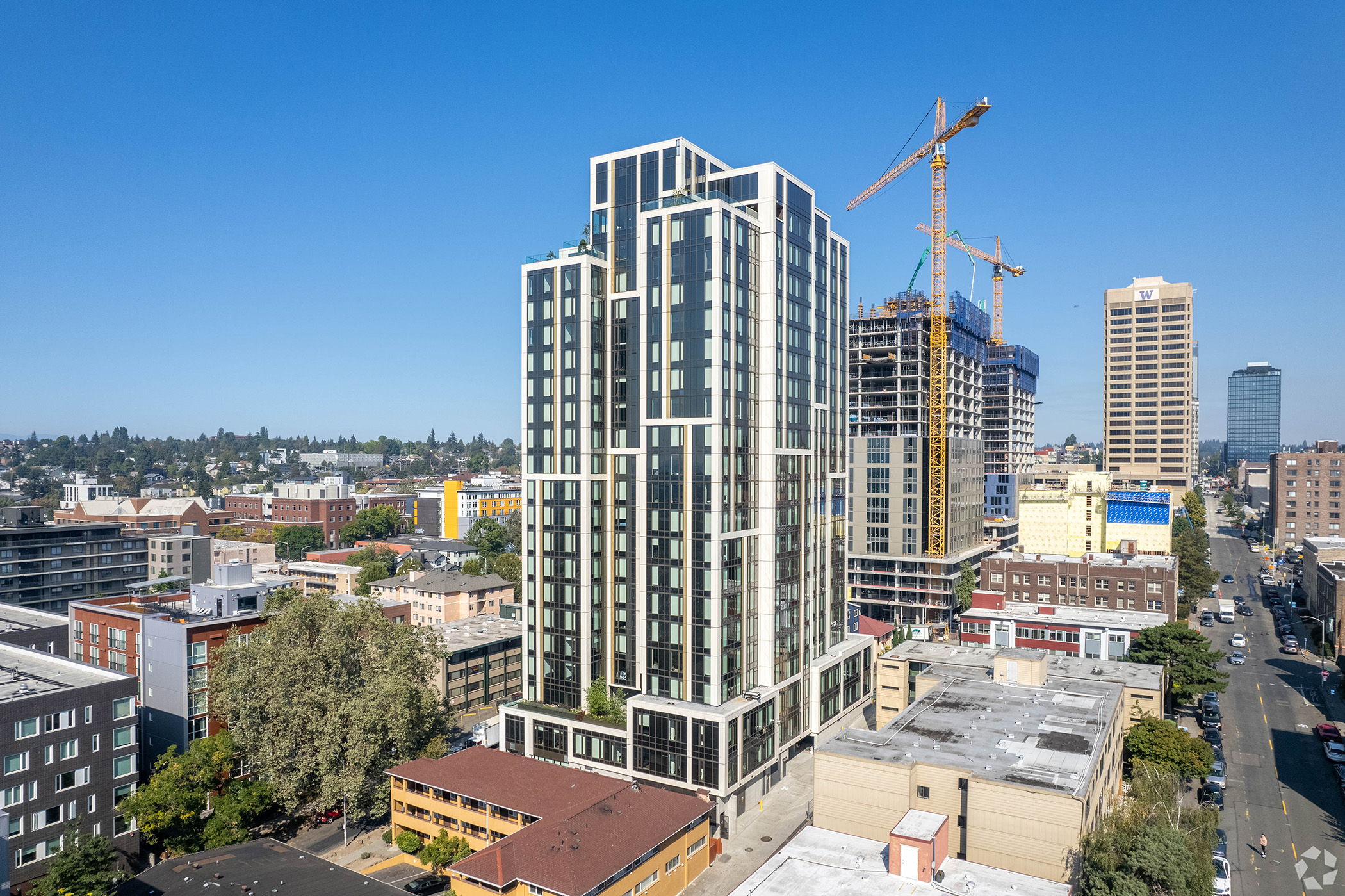 The Accolade, a 21-story student housing complex at 4126 12th Ave. NE in Seattle, is one of two properties that received refinancing loans from Affinius Capital. (CoStar)