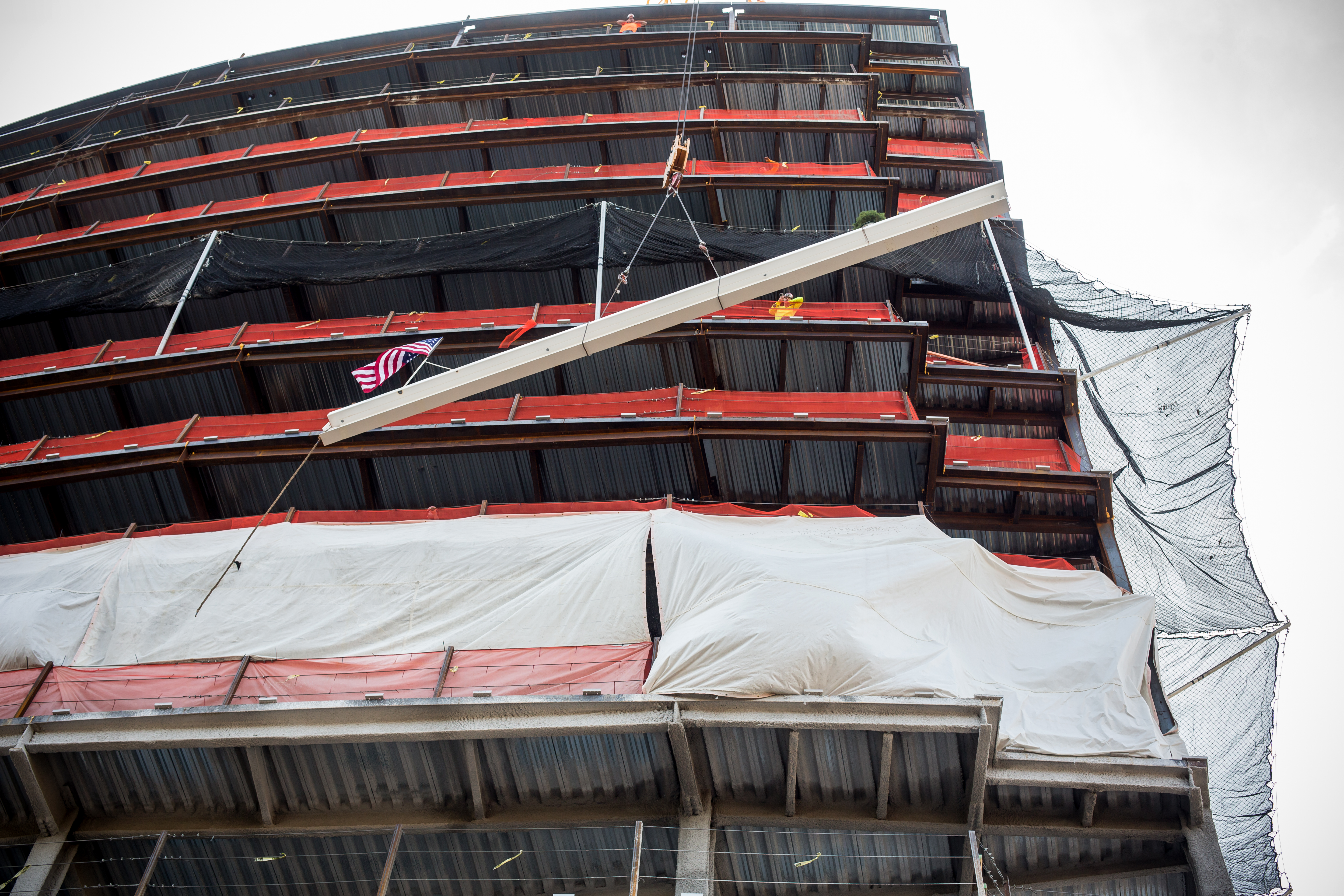 An American flag and a small scrub were on the ceremonial steel beam that was lifted to the top of Robert Wood Johnson University Hospital's new ambulatory pavilion in New Brunswick this week. (AST)